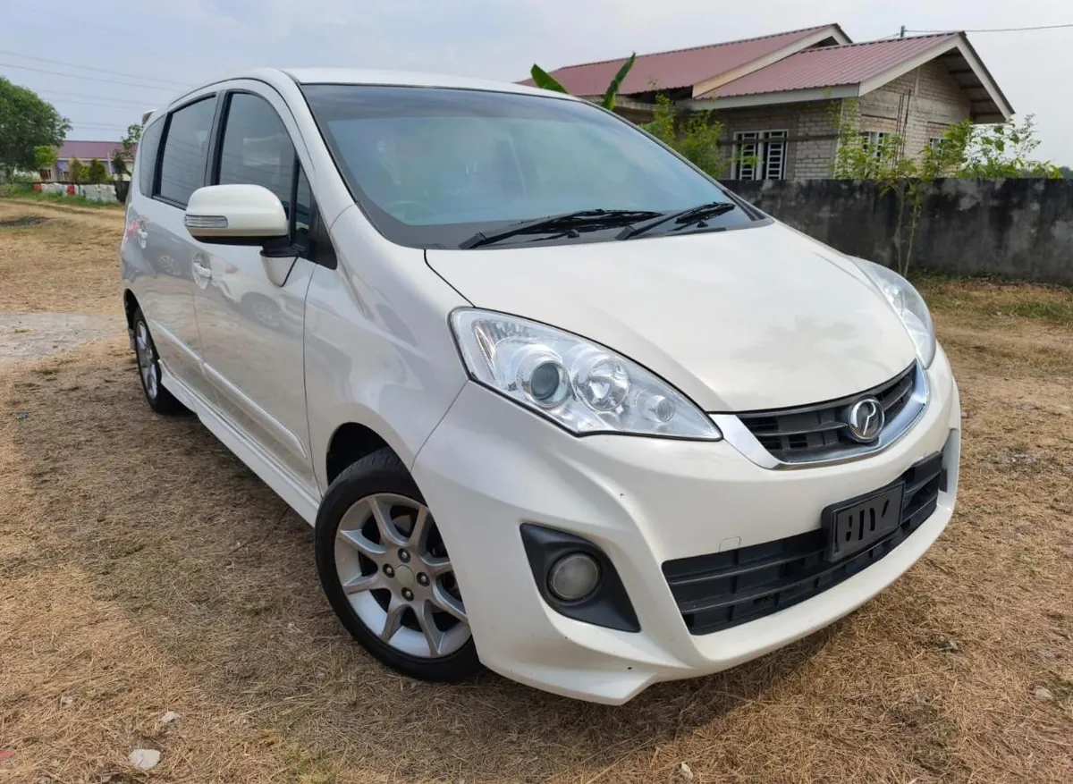 White Perodua Alza 7-seater rental car